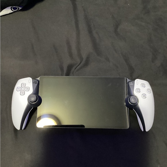 Sony Handheld Console with Black and White Controllers